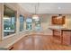 Breakfast area with hardwood floors, granite counters, and views of pool at 233 Spear Rd, Fayetteville, GA 30215