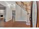 Inviting foyer with hardwood floors, staircase, and views into multiple rooms at 233 Spear Rd, Fayetteville, GA 30215