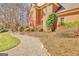 Brick home with a meticulously landscaped walkway leading to the front entrance at 233 Spear Rd, Fayetteville, GA 30215