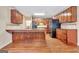 Traditional kitchen with granite countertops, wooden cabinets, and stainless steel appliances at 233 Spear Rd, Fayetteville, GA 30215