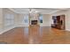 Spacious living room boasting a stone fireplace, wood floors, and bright windows at 233 Spear Rd, Fayetteville, GA 30215