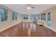 Sunroom with light walls, fan, and views of the private yard at 233 Spear Rd, Fayetteville, GA 30215