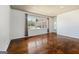 Bright living room featuring hardwood floors, a large window, and white walls at 623 Swan Lake Rd, Stockbridge, GA 30281