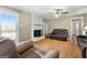 Comfortable living room featuring a fireplace, neutral walls, backyard access, and plush seating at 623 Swan Lake Rd, Stockbridge, GA 30281