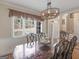 Dining room with hardwood floors and a view of the foyer featuring natural light at 355 Parker Rd, Covington, GA 30014