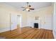 Charming bedroom with hardwood floors, fireplace, and a window with natural light at 1669 Spring Ne St, Conyers, GA 30012