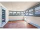 Sunlit bonus room with a wall of windows, hardwood floors, and a built-in shelf at 1669 Spring Ne St, Conyers, GA 30012