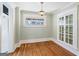 Cozy dining room with hardwood floors, elegant lighting, and a built-in glass display cabinet at 1669 Spring Ne St, Conyers, GA 30012