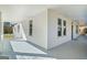 Spacious white porch with white railings and columns for outdoor enjoyment at 1669 Spring Ne St, Conyers, GA 30012