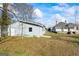 Side view of a detached garage situated next to a charming home at 1669 Spring Ne St, Conyers, GA 30012