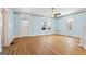 Bright living room with hardwood floors, and neutral-colored blue walls at 1669 Spring Ne St, Conyers, GA 30012