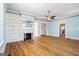 Large living room with hardwood floors, fireplace, and built-in shelving unit at 1669 Spring Ne St, Conyers, GA 30012