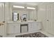 Bright bathroom featuring double vanity and extra large mirror at 375 Darren Dr, Fayetteville, GA 30215