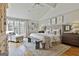 Spacious bedroom featuring a ceiling fan, hardwood floors, sitting area and decor at 375 Darren Dr, Fayetteville, GA 30215