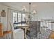 Charming dining area with large windows and a chandelier lighting the dining table at 375 Darren Dr, Fayetteville, GA 30215