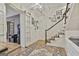 Inviting entryway featuring a unique starburst light fixture, stylish gallery wall, and charming sliding barn door at 375 Darren Dr, Fayetteville, GA 30215