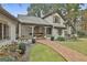 The front exterior showcasing a brick pathway, lush plants, and charming architectural design at 375 Darren Dr, Fayetteville, GA 30215