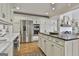 Bright kitchen with white cabinets, stainless steel appliances and a center island with black countertop at 375 Darren Dr, Fayetteville, GA 30215