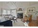 Inviting living room with vaulted ceilings, fireplace, and French doors to the exterior at 375 Darren Dr, Fayetteville, GA 30215