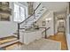 Elegant staircase featuring wood railings and a decorative table at 375 Darren Dr, Fayetteville, GA 30215