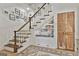 Cozy nook under the staircase with built-in bookshelves and a cushioned seating area at 375 Darren Dr, Fayetteville, GA 30215