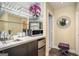 Bar area features a mirrored backsplash, glassware, a microwave, and a mini-fridge at 3192 Paces Mill Se Rd, Atlanta, GA 30339