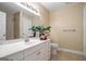 This bathroom features a large vanity with white cabinets and a tiled floor at 3192 Paces Mill Se Rd, Atlanta, GA 30339