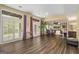 Spacious room features hardwood floors, large windows, purple accents, and a dining area with built-in shelving at 3192 Paces Mill Se Rd, Atlanta, GA 30339