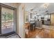 Inviting living space with an open layout showcasing hardwood floors and a seamless flow to the updated kitchen at 2545 Rockbridge Nw Rd, Conyers, GA 30012