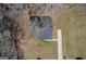 An overhead aerial view of the house, roof, yard and driveway at 505 Phillips Dr, Palmetto, GA 30268
