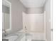 Bathroom featuring a tub-shower combo with white subway tile and a marble-look vanity at 505 Phillips Dr, Palmetto, GA 30268