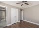 Bedroom with closet, ceiling fan, wood-look floors, and ensuite bathroom access at 505 Phillips Dr, Palmetto, GA 30268
