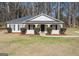 Charming single story home with black shutters and a well-maintained front lawn at 505 Phillips Dr, Palmetto, GA 30268