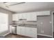 Bright kitchen featuring sleek stainless steel appliances and ample cabinet space at 505 Phillips Dr, Palmetto, GA 30268