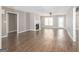Spacious living room featuring wood floors, neutral paint, and a cozy fireplace at 505 Phillips Dr, Palmetto, GA 30268