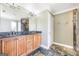 Bathroom features a double vanity with stylish cabinets and slate tile flooring at 603 Honey Creek Rd, Mcdonough, GA 30252