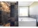 Modern bathroom with a walk-in shower and a relaxing soaking tub with jets at 603 Honey Creek Rd, Mcdonough, GA 30252