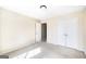 Bright, carpeted bedroom with closet doors, neutral walls, and natural light at 603 Honey Creek Rd, Mcdonough, GA 30252