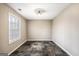 Dining room with stone-look floors and natural light from a large window at 603 Honey Creek Rd, Mcdonough, GA 30252