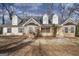 Charming single-Gathering home with stone accents and dormer windows, set amidst mature trees at 603 Honey Creek Rd, Mcdonough, GA 30252