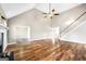 Open living space with hardwood floors, fireplace, and staircase at 603 Honey Creek Rd, Mcdonough, GA 30252
