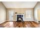 Living room featuring hardwood floors and a black marble fireplace at 603 Honey Creek Rd, Mcdonough, GA 30252