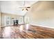 Spacious living room with a cathedral ceiling, hardwood floors, fireplace, and fan at 603 Honey Creek Rd, Mcdonough, GA 30252