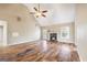 Large living room featuring hardwood floors, vaulted ceiling, and a cozy fireplace at 603 Honey Creek Rd, Mcdonough, GA 30252