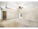 Large main bedroom featuring a ceiling fan, carpet, and an adjoining walk-in closet at 603 Honey Creek Rd, Mcdonough, GA 30252