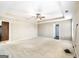 A view of a main bedroom that features carpet, a ceiling fan, and neutral walls at 603 Honey Creek Rd, Mcdonough, GA 30252