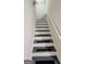 Carpeted stairway with white risers and grey treads at 2019 Chelton Se Way, Smyrna, GA 30080