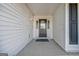 Classic black front door with decorative glass panel and sidelights provides a welcoming entry to the home at 88 Harbour Lake Dr, Fayetteville, GA 30215