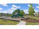 Community playground with slides, seating, and safety surface at 552 Whitman Lane # 2014, Stockbridge, GA 30281