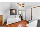 Bedroom featuring wood floors, a ceiling fan, and a white day bed at 108 Everhill, Peachtree City, GA 30269